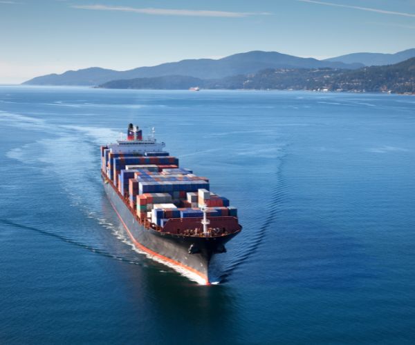Loaded container ship gliding through the ocean