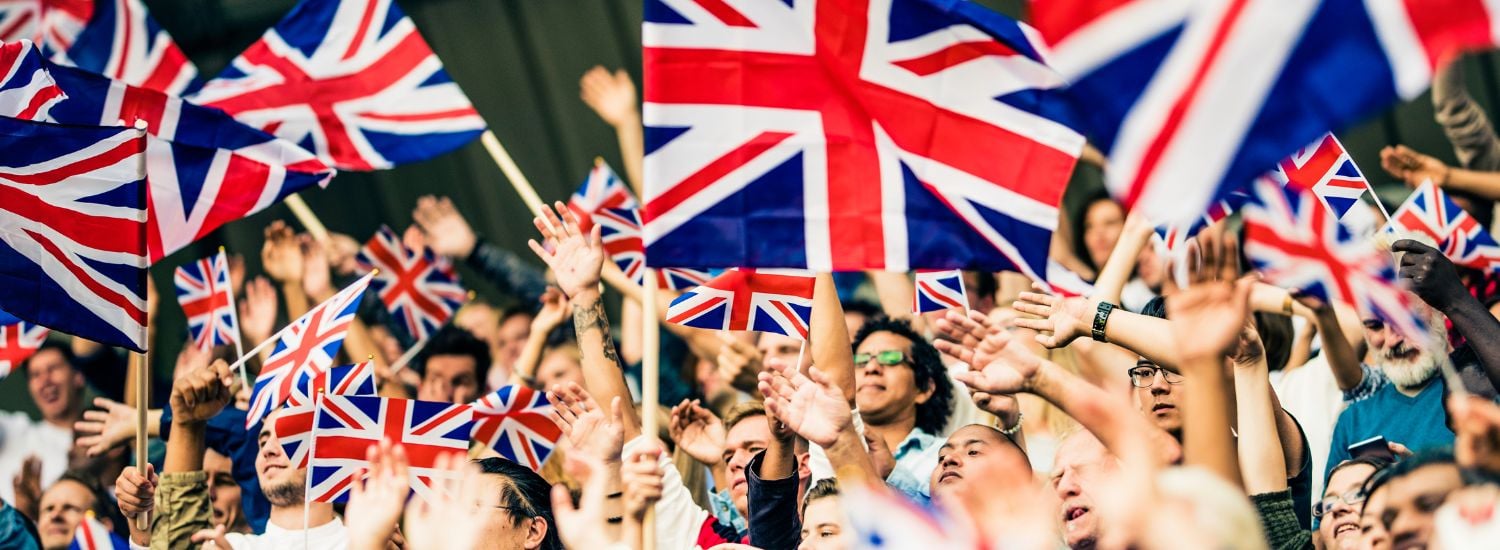 People waving British flags