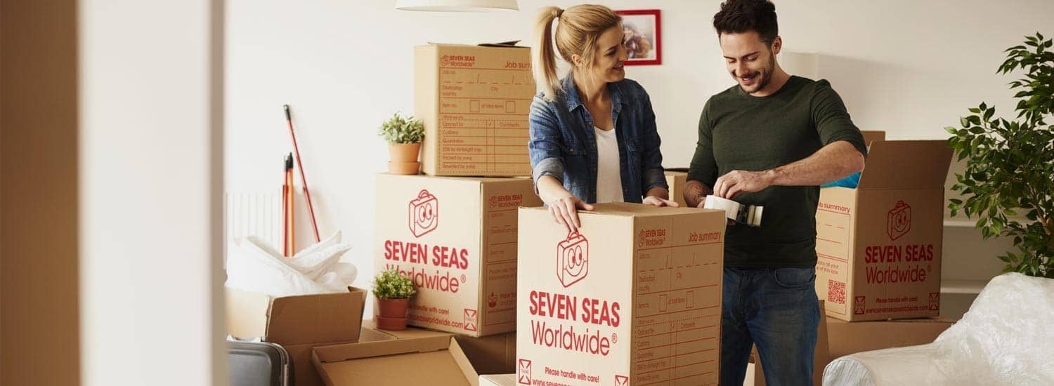 Couple packing belongings for international removals