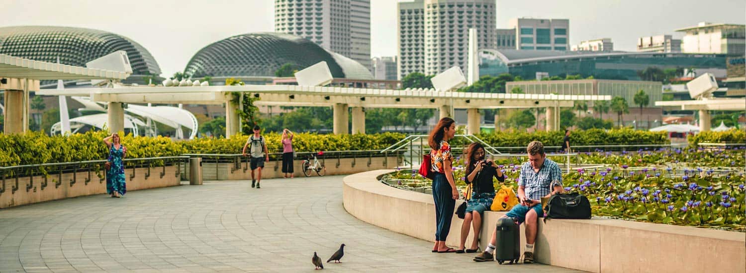 Family sitting in Marina Bay in Singapore