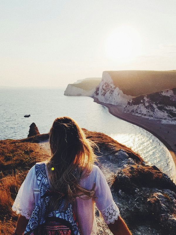 Young woman hiking on cliffs in the UK