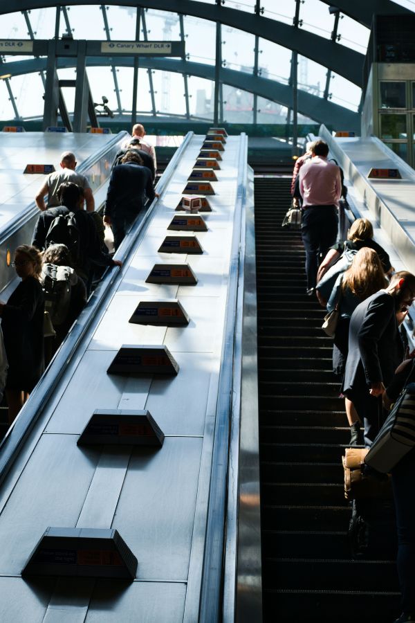 People on an escalator in London