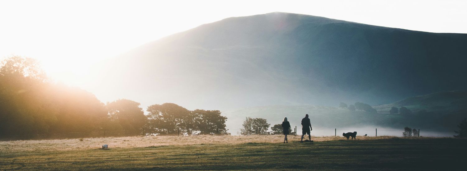 Couple hiking in the Lake District at dawn