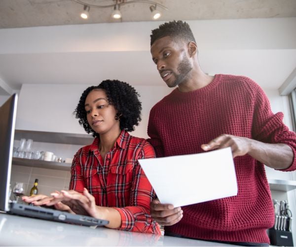 Couple completing an online form