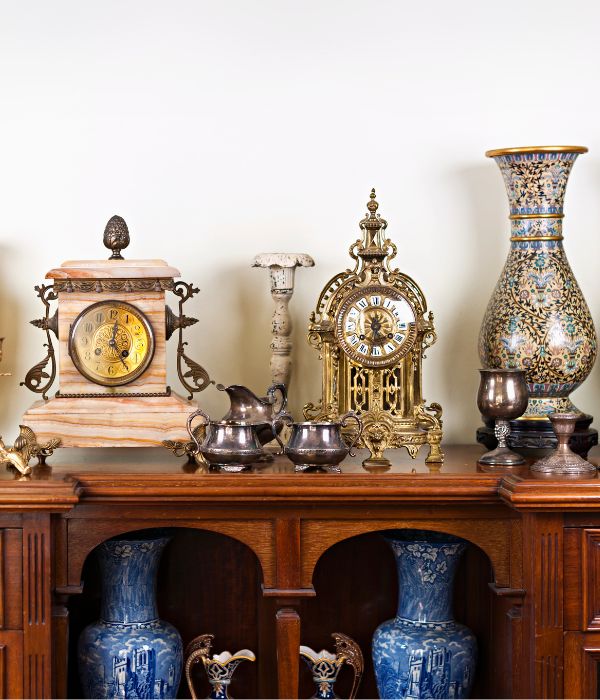 Collection of antique items on a sideboard