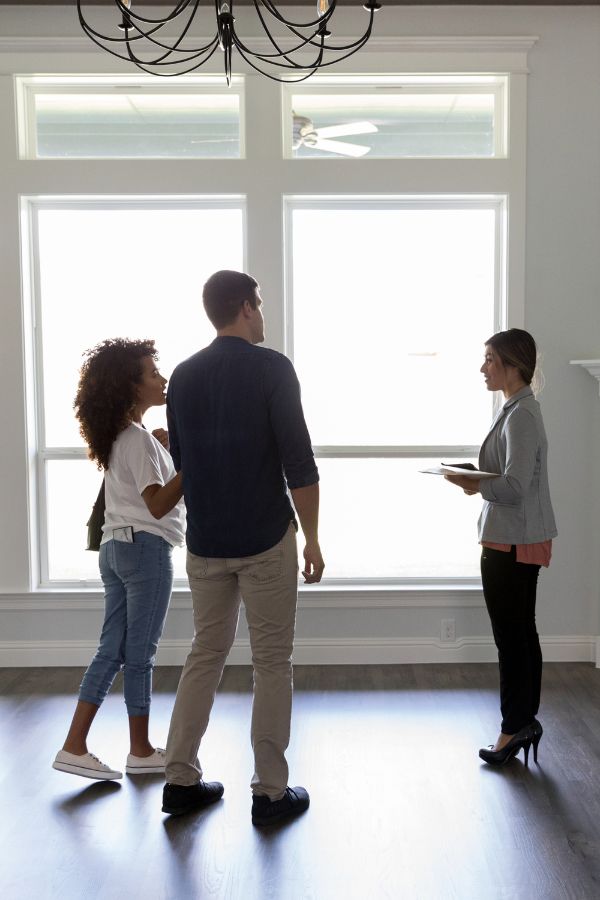 Couple being shown a property in Singapore