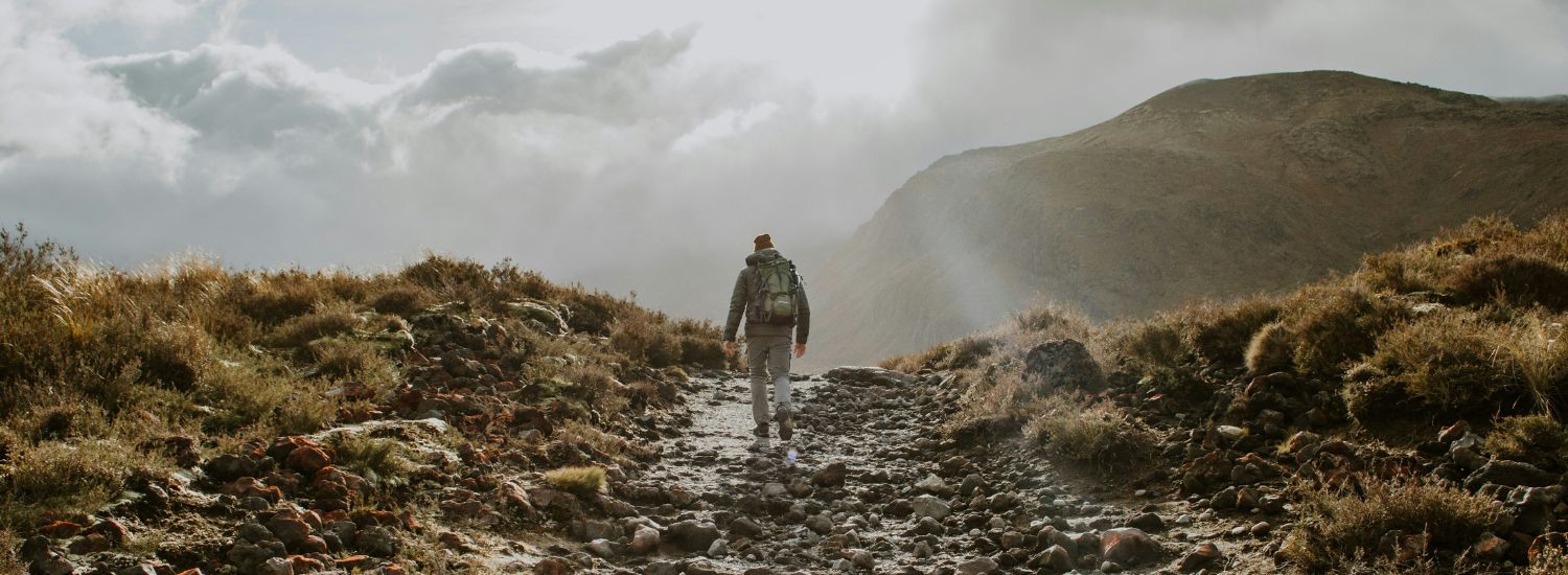 Person hiking through the mountains in New Zealand