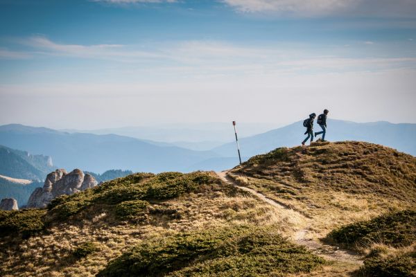 Couple climbing a mountain in New Zealand