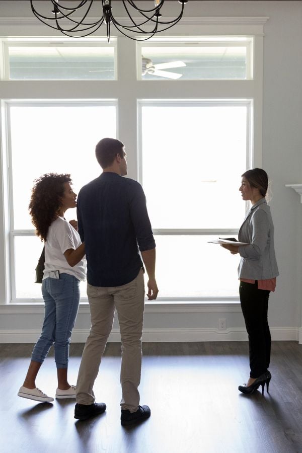 Couple being shown a property in Australia