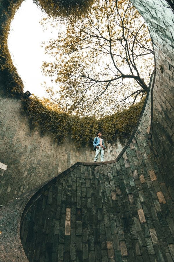 Man climbing a staircase in a park in Singapore