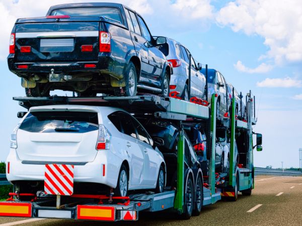 Lorry transporting cars along a motorway