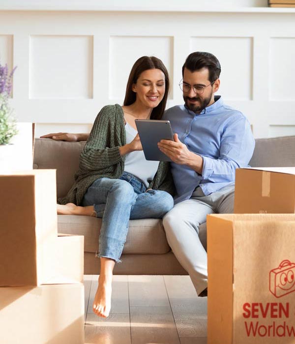 Couple looking at customs regulations on a tablet