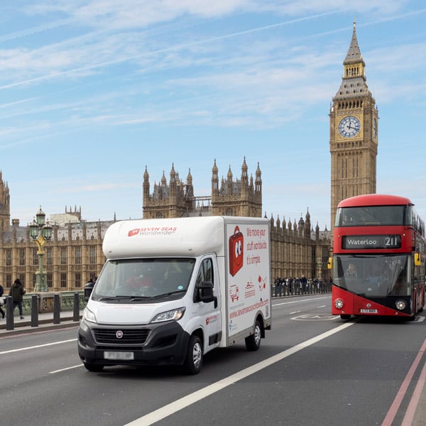 Removals van driving past Big Ben in London