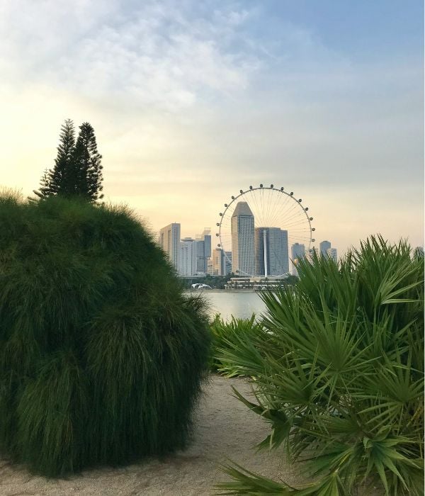 View over Singapore Marina from a sandy beach