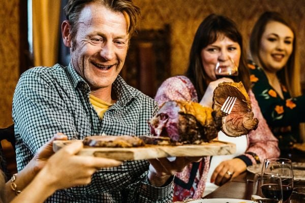 Family sharing a roast dinner