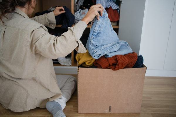 Woman sorting through clothes